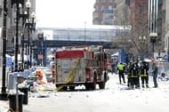 Firefighters take postion near the finish line after two bombs exploded during the Boston Marathon on April 15, 2013